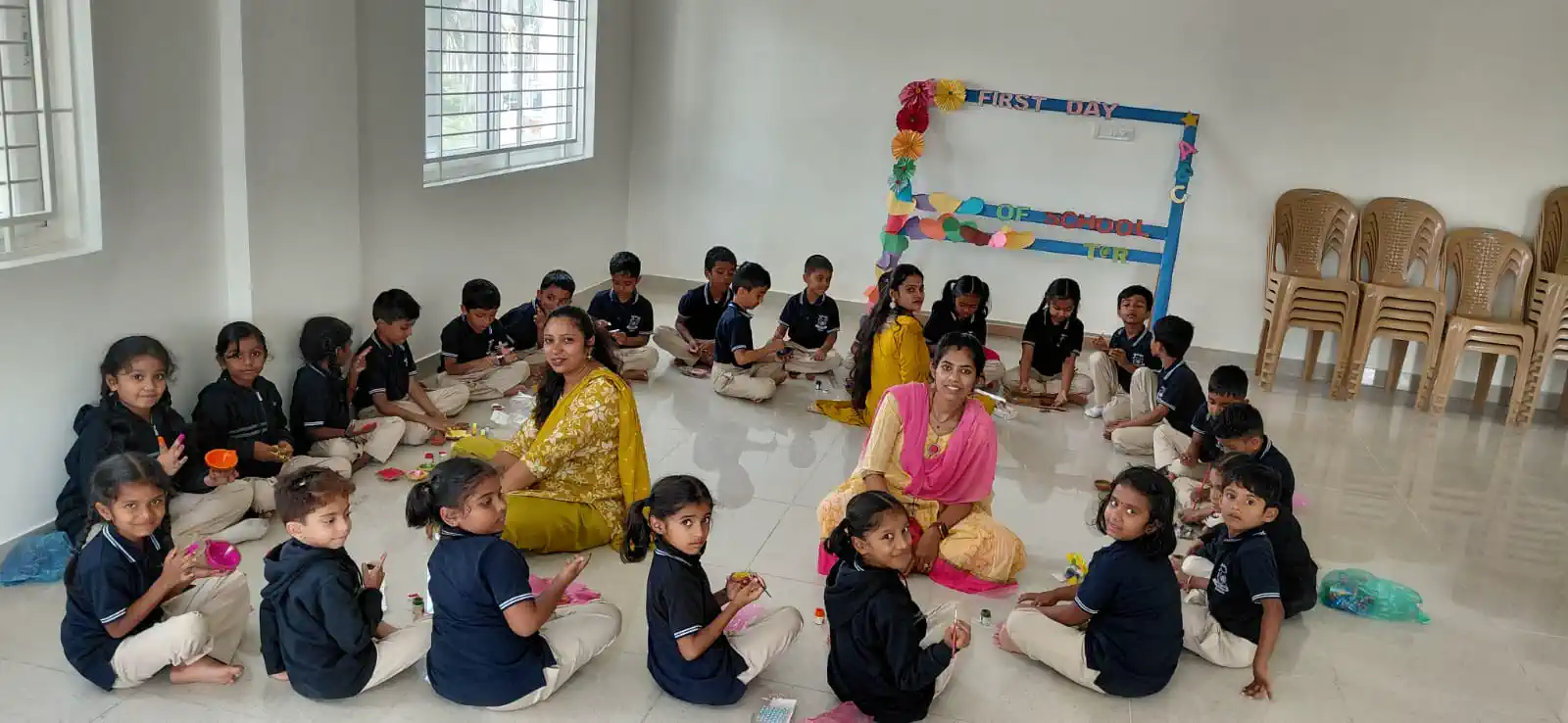 Pre-school children in a circle-time session with their teacher at Takshashila School