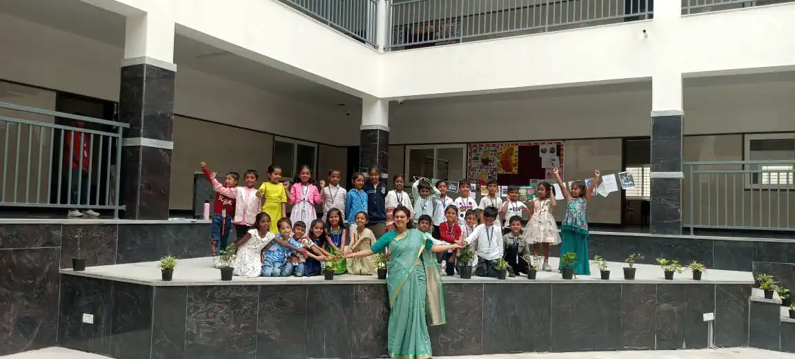 Parents and students at a school event in the open courtyard of Takshashila School @ Rampura