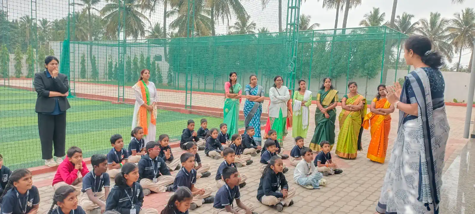 Students and teachers gathered on the sports ground for an outdoor event at Takshashila School