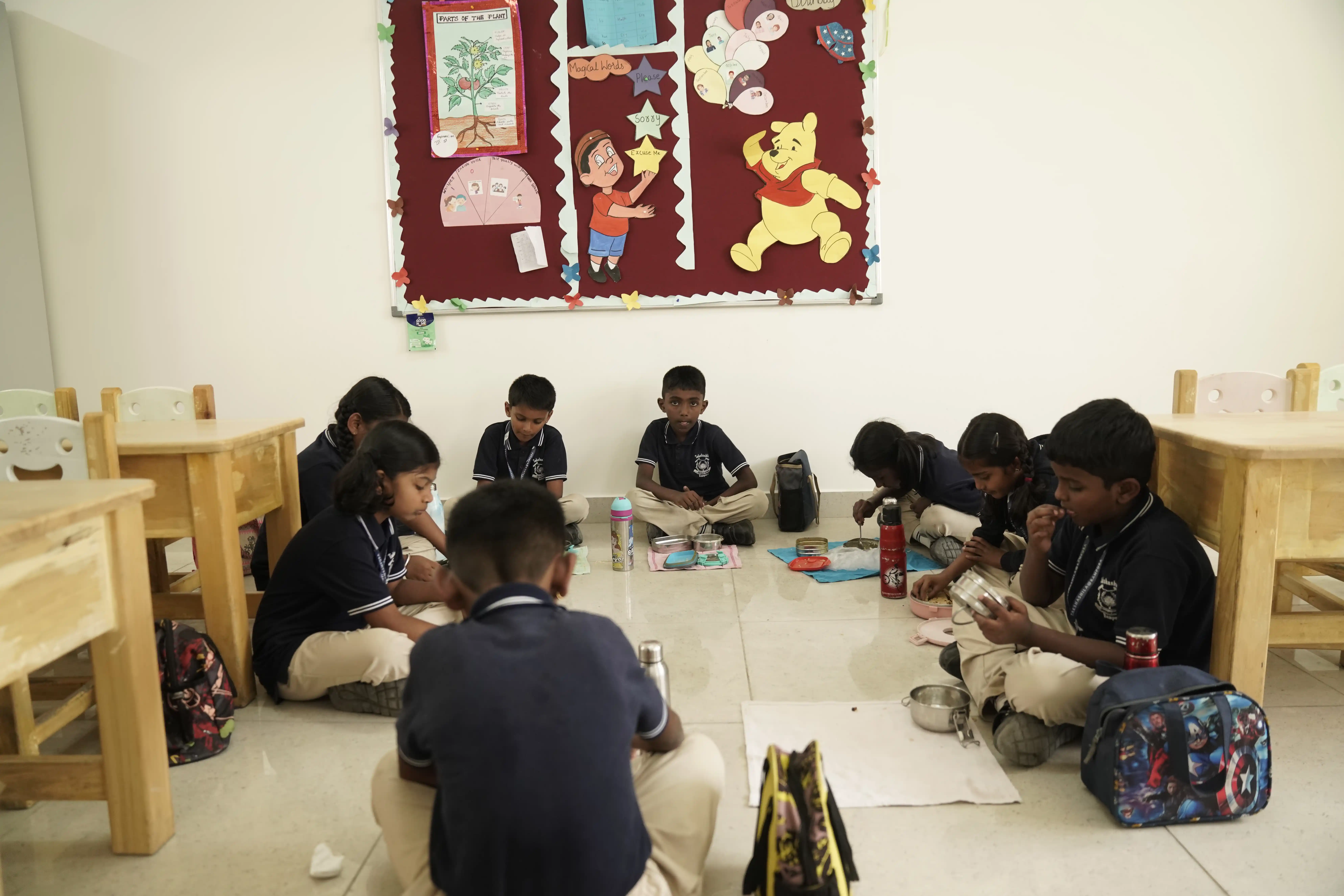 Students working together on a floor activity in a Takshashila School classroom