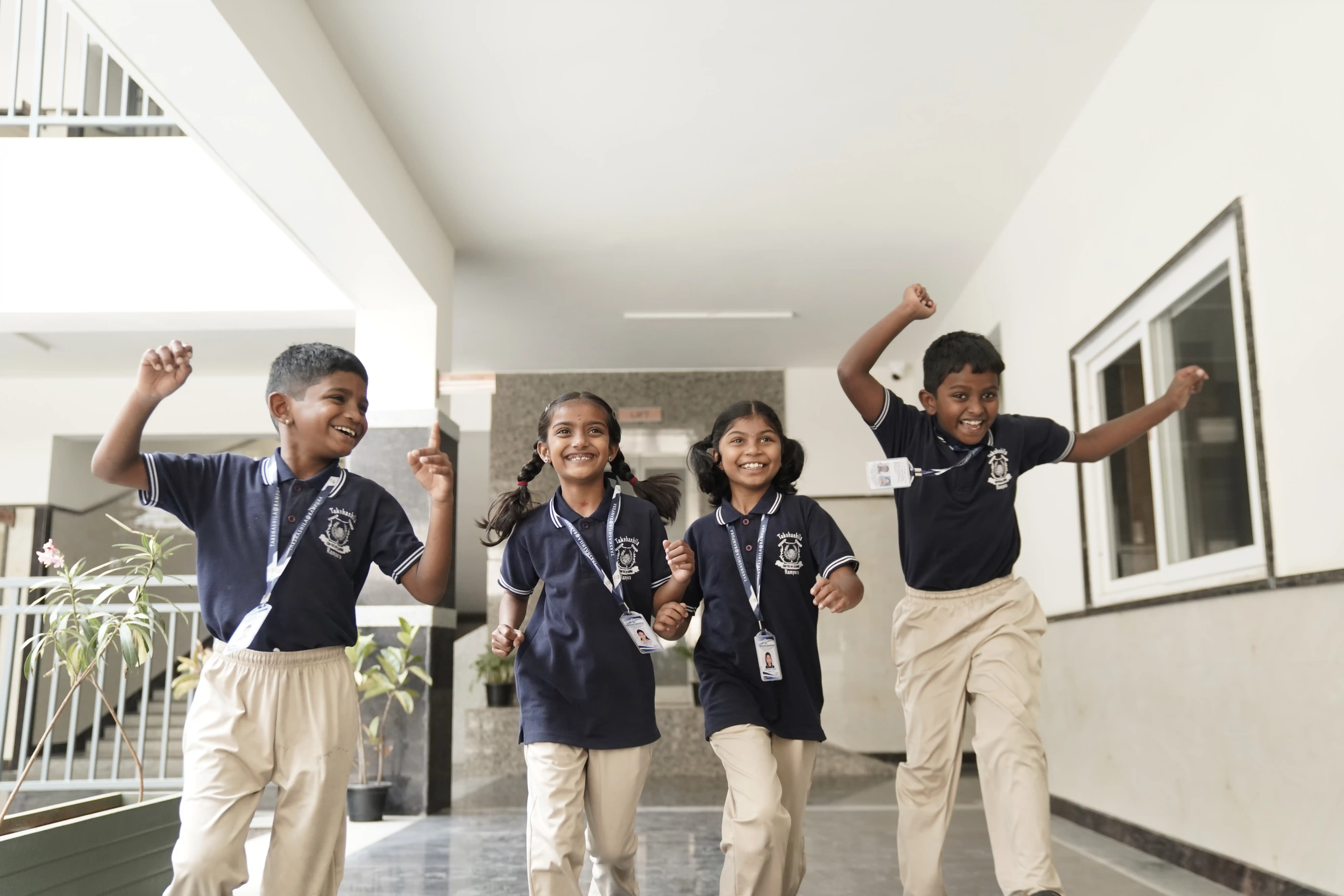 Students cheering in the school corridor at Takshashila School @ Rampura
