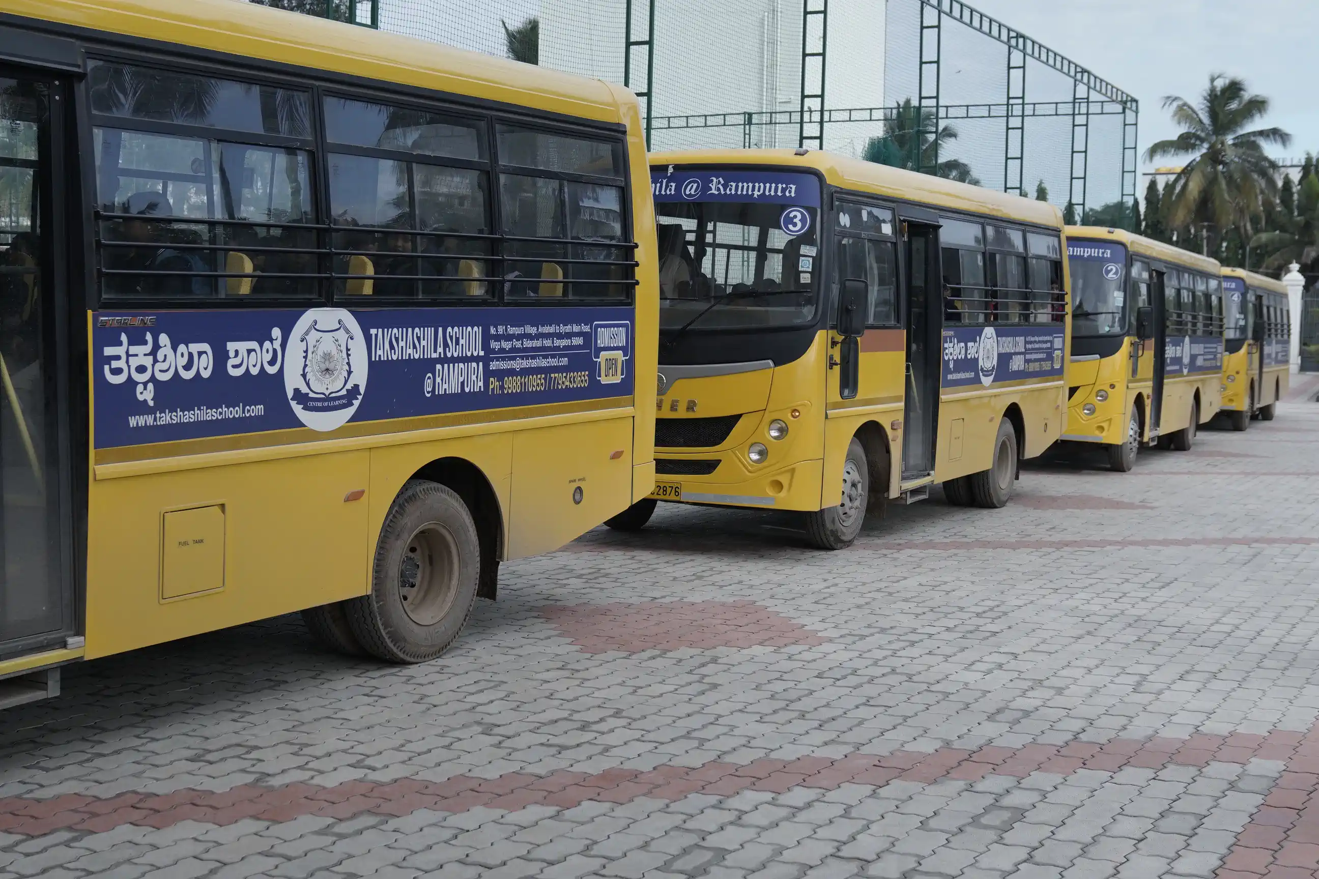 Takshashila School @ Rampura school buses parked on campus
